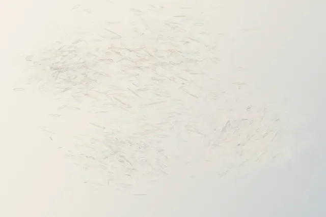 Four faint pressure zones appear and recede across ivory paper; lifted planes and warm reflection imply an absent body through occlusion rather than a contour.